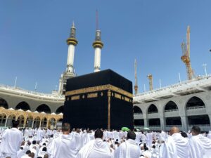 Crowd of worshippers in Mecca surrounding the Kaaba at the Grand Mosque during pilgrimage.